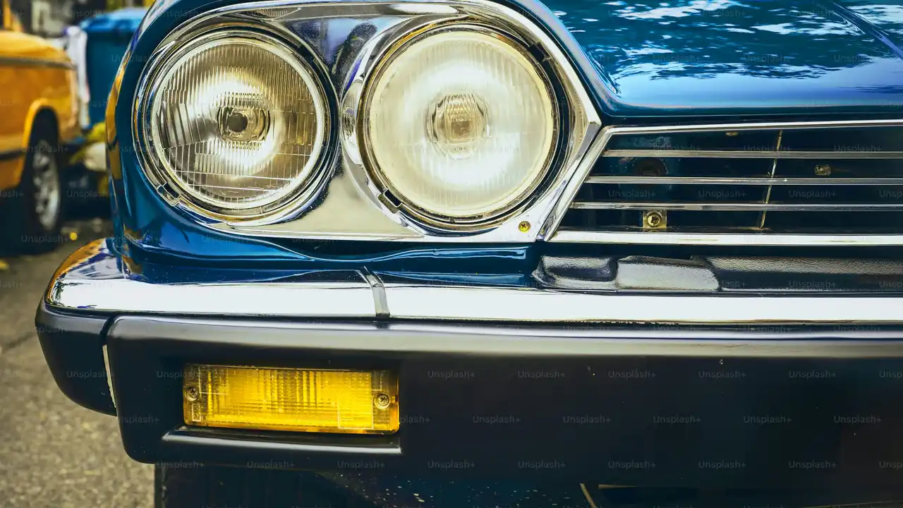 Two mint chocolate milkshakes with whipped cream and green sprinkles.